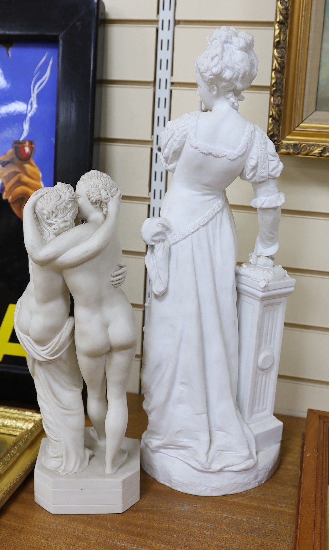 A Victorian Parian group and a 19th century French bisque figure. Tallest 63cm